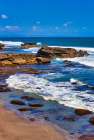 Sunset at rocky shoreline of Love Beach. Art Print